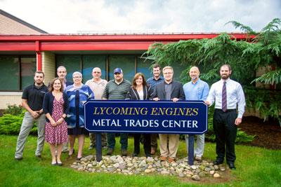 Representatives from Lycoming Engines and the Penn College community gathered to dedicate the Lycoming Engines Metal Trades Center sign on the front lawn of the facility. 