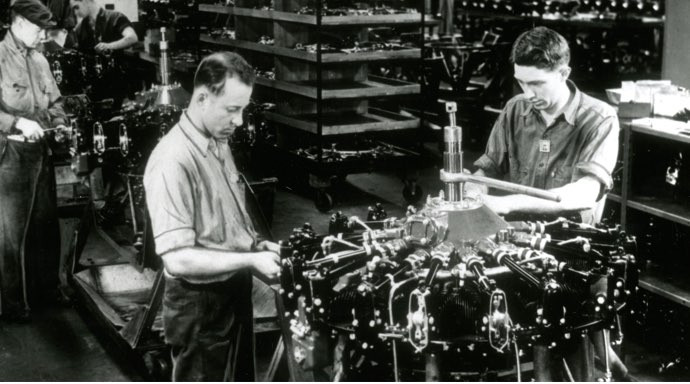 two men working on engine